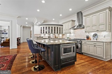Welcome to an extraordinary six-bedroom, seven full and two on The Golf Club of Georgia in Georgia - for sale on GolfHomes.com, golf home, golf lot