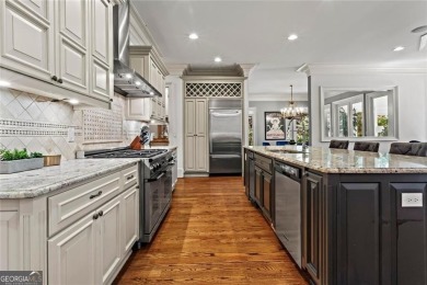 Welcome to an extraordinary six-bedroom, seven full and two on The Golf Club of Georgia in Georgia - for sale on GolfHomes.com, golf home, golf lot