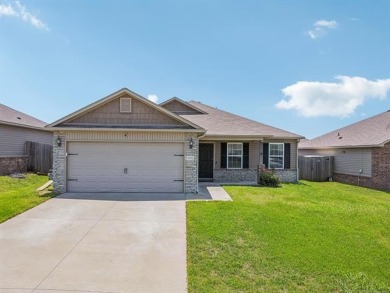 Tucked away in a well-established neighborhood and less than a on White Hawk Golf Club in Oklahoma - for sale on GolfHomes.com, golf home, golf lot