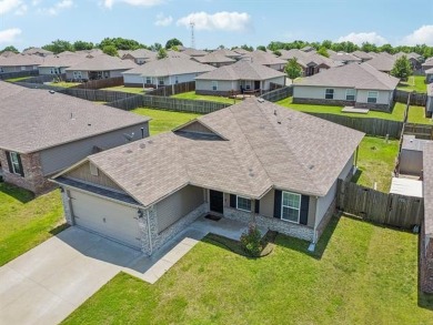 Tucked away in a well-established neighborhood and less than a on White Hawk Golf Club in Oklahoma - for sale on GolfHomes.com, golf home, golf lot