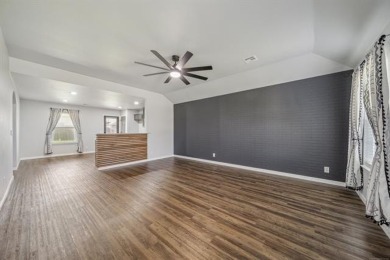 Tucked away in a well-established neighborhood and less than a on White Hawk Golf Club in Oklahoma - for sale on GolfHomes.com, golf home, golf lot