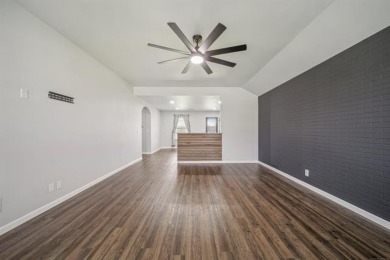 Tucked away in a well-established neighborhood and less than a on White Hawk Golf Club in Oklahoma - for sale on GolfHomes.com, golf home, golf lot