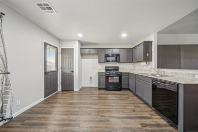 Tucked away in a well-established neighborhood and less than a on White Hawk Golf Club in Oklahoma - for sale on GolfHomes.com, golf home, golf lot