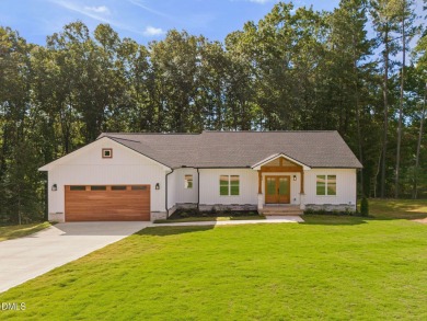 Enjoy one-level living in this beautifully crafted custom ranch on River Golf and Country Club at Lake Royale in North Carolina - for sale on GolfHomes.com, golf home, golf lot