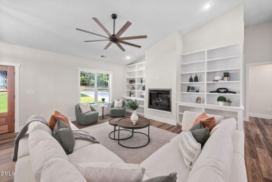 Enjoy one-level living in this beautifully crafted custom ranch on River Golf and Country Club at Lake Royale in North Carolina - for sale on GolfHomes.com, golf home, golf lot