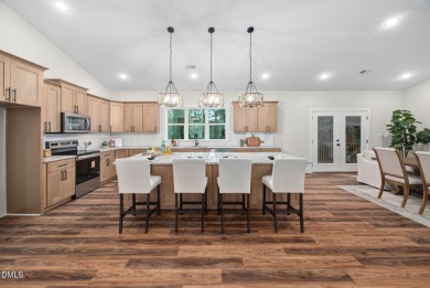 Enjoy one-level living in this beautifully crafted custom ranch on River Golf and Country Club at Lake Royale in North Carolina - for sale on GolfHomes.com, golf home, golf lot