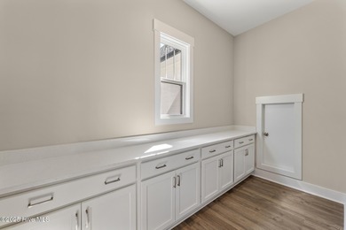 Welcome to your ideal coastal retreat! This beautiful 1.5 story on Crow Creek Golf Club in North Carolina - for sale on GolfHomes.com, golf home, golf lot