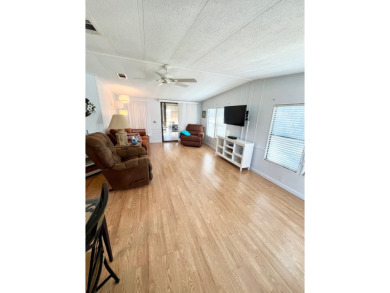 Welcome to this beautifully maintained 2-bedroom, 2-bath home in on Pine Lakes Country Club in Florida - for sale on GolfHomes.com, golf home, golf lot