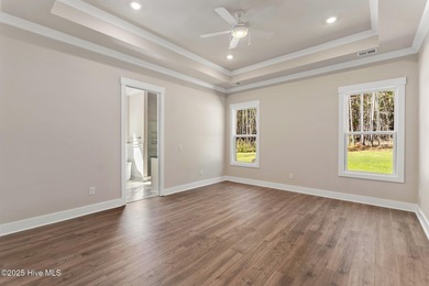 Welcome to your ideal coastal retreat! This beautiful 1.5 story on Crow Creek Golf Club in North Carolina - for sale on GolfHomes.com, golf home, golf lot