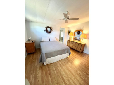 Welcome to this beautifully maintained 2-bedroom, 2-bath home in on Pine Lakes Country Club in Florida - for sale on GolfHomes.com, golf home, golf lot
