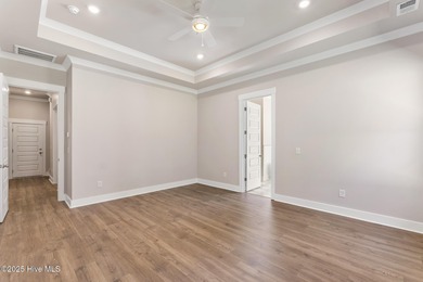 Welcome to your ideal coastal retreat! This beautiful 1.5 story on Crow Creek Golf Club in North Carolina - for sale on GolfHomes.com, golf home, golf lot