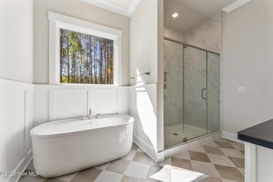 Welcome to your ideal coastal retreat! This beautiful 1.5 story on Crow Creek Golf Club in North Carolina - for sale on GolfHomes.com, golf home, golf lot