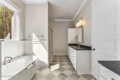 Welcome to your ideal coastal retreat! This beautiful 1.5 story on Crow Creek Golf Club in North Carolina - for sale on GolfHomes.com, golf home, golf lot