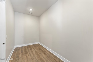 Welcome to your ideal coastal retreat! This beautiful 1.5 story on Crow Creek Golf Club in North Carolina - for sale on GolfHomes.com, golf home, golf lot