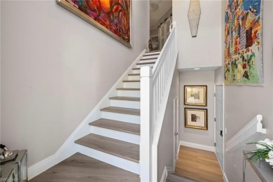 Corner end-unit, second-floor coach home filled with natural on Windstar on Naples Bay in Florida - for sale on GolfHomes.com, golf home, golf lot