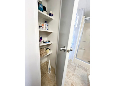 Welcome to this beautifully maintained 2-bedroom, 2-bath home in on Pine Lakes Country Club in Florida - for sale on GolfHomes.com, golf home, golf lot