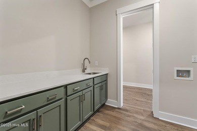 Welcome to your ideal coastal retreat! This beautiful 1.5 story on Crow Creek Golf Club in North Carolina - for sale on GolfHomes.com, golf home, golf lot