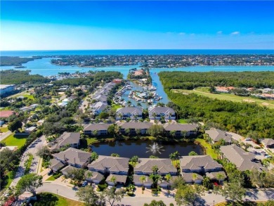 Corner end-unit, second-floor coach home filled with natural on Windstar on Naples Bay in Florida - for sale on GolfHomes.com, golf home, golf lot