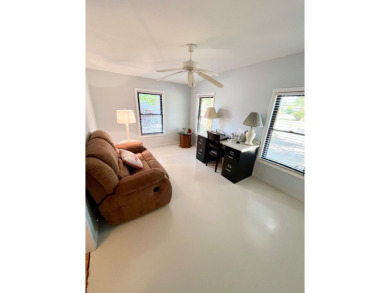 Welcome to this beautifully maintained 2-bedroom, 2-bath home in on Pine Lakes Country Club in Florida - for sale on GolfHomes.com, golf home, golf lot