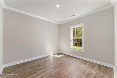 Welcome to your ideal coastal retreat! This beautiful 1.5 story on Crow Creek Golf Club in North Carolina - for sale on GolfHomes.com, golf home, golf lot