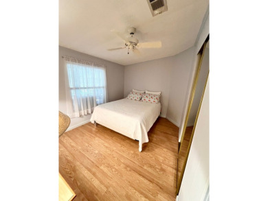 Welcome to this beautifully maintained 2-bedroom, 2-bath home in on Pine Lakes Country Club in Florida - for sale on GolfHomes.com, golf home, golf lot