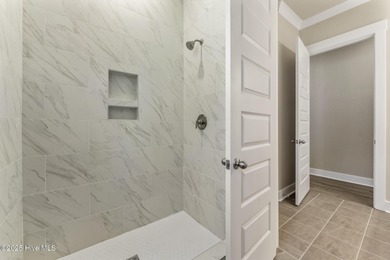 Welcome to your ideal coastal retreat! This beautiful 1.5 story on Crow Creek Golf Club in North Carolina - for sale on GolfHomes.com, golf home, golf lot