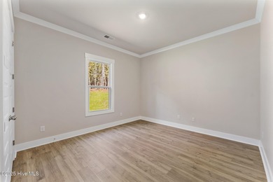 Welcome to your ideal coastal retreat! This beautiful 1.5 story on Crow Creek Golf Club in North Carolina - for sale on GolfHomes.com, golf home, golf lot