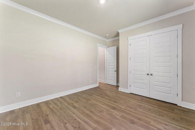 Welcome to your ideal coastal retreat! This beautiful 1.5 story on Crow Creek Golf Club in North Carolina - for sale on GolfHomes.com, golf home, golf lot