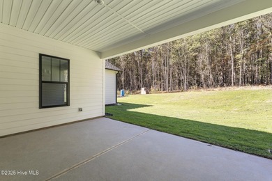 Welcome to your ideal coastal retreat! This beautiful 1.5 story on Crow Creek Golf Club in North Carolina - for sale on GolfHomes.com, golf home, golf lot
