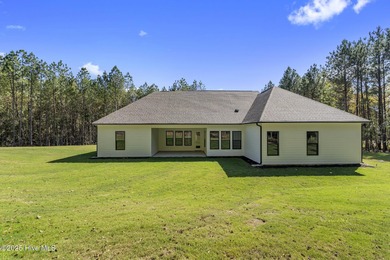 Welcome to your ideal coastal retreat! This beautiful 1.5 story on Crow Creek Golf Club in North Carolina - for sale on GolfHomes.com, golf home, golf lot