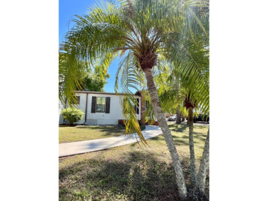 Welcome to this beautifully maintained 2-bedroom, 2-bath home in on Pine Lakes Country Club in Florida - for sale on GolfHomes.com, golf home, golf lot