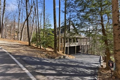 This Rustic Mountain Lodge is perfectly positioned on nearly a on Big Canoe Golf Club - Cherokee in Georgia - for sale on GolfHomes.com, golf home, golf lot