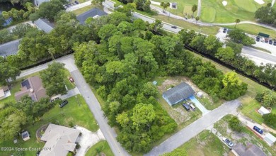 Nestled in the heart of New Smyrna Beach, this treed buildable on New Smyrna Beach Golf Course in Florida - for sale on GolfHomes.com, golf home, golf lot