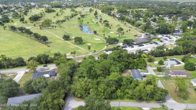 Nestled in the heart of New Smyrna Beach, this treed buildable on New Smyrna Beach Golf Course in Florida - for sale on GolfHomes.com, golf home, golf lot