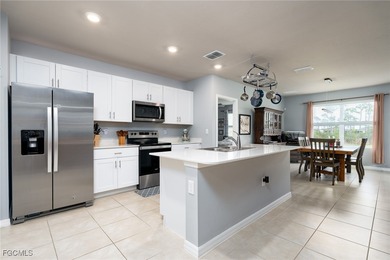 Welcome to this 2023-built home located on a premium lot backing on Herons Glen Golf and Country Club in Florida - for sale on GolfHomes.com, golf home, golf lot