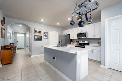 Welcome to this 2023-built home located on a premium lot backing on Herons Glen Golf and Country Club in Florida - for sale on GolfHomes.com, golf home, golf lot