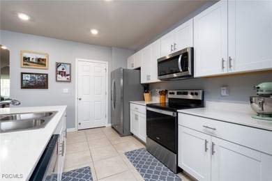 Welcome to this 2023-built home located on a premium lot backing on Herons Glen Golf and Country Club in Florida - for sale on GolfHomes.com, golf home, golf lot