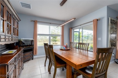 Welcome to this 2023-built home located on a premium lot backing on Herons Glen Golf and Country Club in Florida - for sale on GolfHomes.com, golf home, golf lot