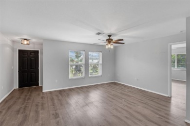Move-in ready, fully remodeled Florida-style home on a corner on Oyster Creek Golf Club in Florida - for sale on GolfHomes.com, golf home, golf lot