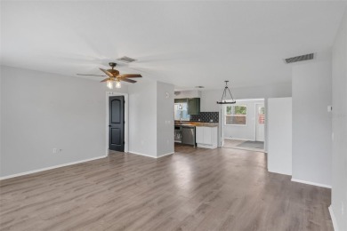 Move-in ready, fully remodeled Florida-style home on a corner on Oyster Creek Golf Club in Florida - for sale on GolfHomes.com, golf home, golf lot