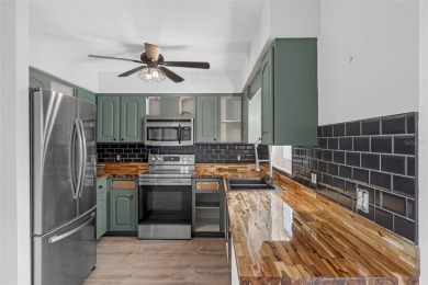 Move-in ready, fully remodeled Florida-style home on a corner on Oyster Creek Golf Club in Florida - for sale on GolfHomes.com, golf home, golf lot