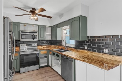 Move-in ready, fully remodeled Florida-style home on a corner on Oyster Creek Golf Club in Florida - for sale on GolfHomes.com, golf home, golf lot