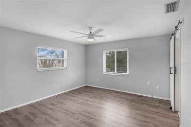 Move-in ready, fully remodeled Florida-style home on a corner on Oyster Creek Golf Club in Florida - for sale on GolfHomes.com, golf home, golf lot