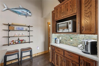 This lake front home in sought after Sugar Valley Lakes sits on on Sugar Valley Lakes Golf Course in Kansas - for sale on GolfHomes.com, golf home, golf lot