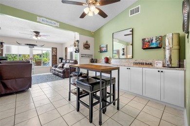 Tucked away on a quaint cul-de-sac, this WATERFRONT POOL HOME in on Duffys Golf Center in Florida - for sale on GolfHomes.com, golf home, golf lot
