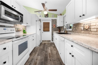 Tucked away on a quaint cul-de-sac, this WATERFRONT POOL HOME in on Duffys Golf Center in Florida - for sale on GolfHomes.com, golf home, golf lot