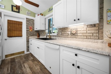 Tucked away on a quaint cul-de-sac, this WATERFRONT POOL HOME in on Duffys Golf Center in Florida - for sale on GolfHomes.com, golf home, golf lot