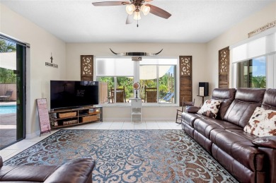 Tucked away on a quaint cul-de-sac, this WATERFRONT POOL HOME in on Duffys Golf Center in Florida - for sale on GolfHomes.com, golf home, golf lot