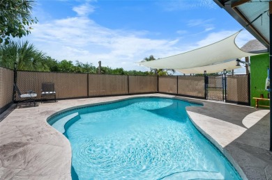 Tucked away on a quaint cul-de-sac, this WATERFRONT POOL HOME in on Duffys Golf Center in Florida - for sale on GolfHomes.com, golf home, golf lot
