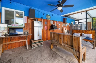 Tucked away on a quaint cul-de-sac, this WATERFRONT POOL HOME in on Duffys Golf Center in Florida - for sale on GolfHomes.com, golf home, golf lot